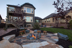 a fire pit in a house with a fire burning